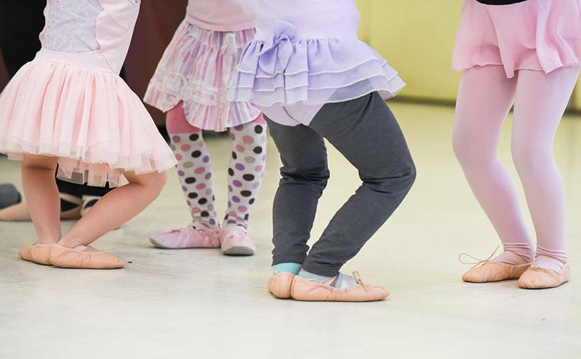 cute little girls in a ballet class with their ballet slippers and tutus