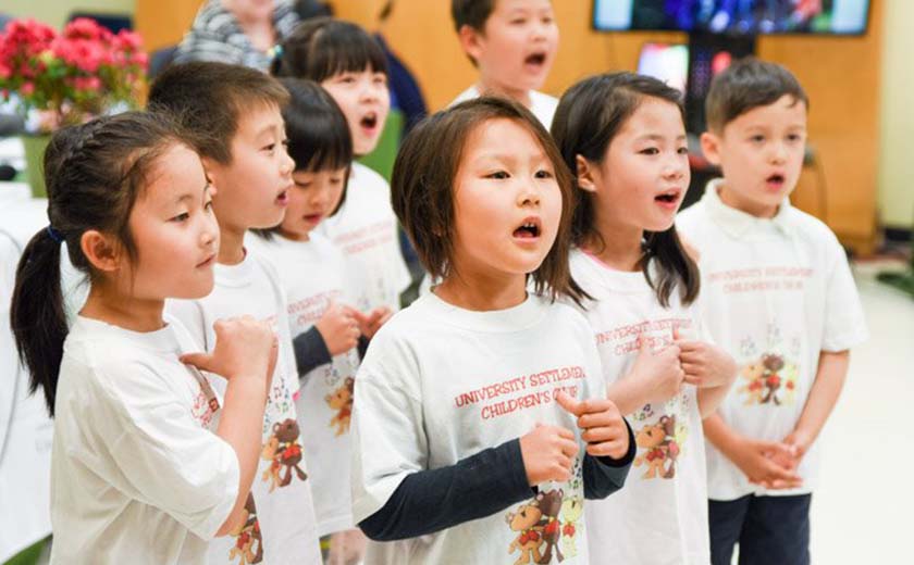 young group of kids singing in a choir